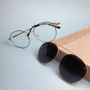 Oculos redondo clip-on cinza armacao dourada