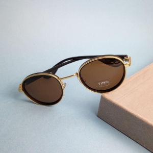 Oculos redondo marrom armacao dourada perna marrom