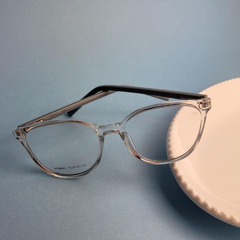 Armacao para oculos de grau redondo na cor transparente com perna azul
