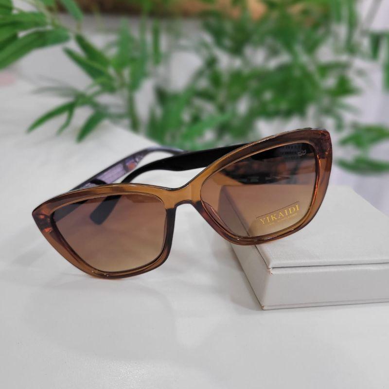 Oculos oval marrom armacao transparencia marrom perna preta