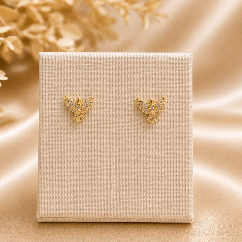 BRINCO ESPIRITO SANTO COM 5 ZIRCÔNIAS BANHADO A OURO 18K